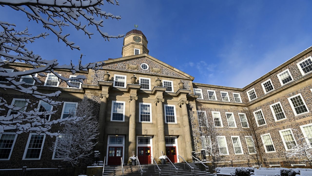 Henry Hicks in winter with snow and blue skies