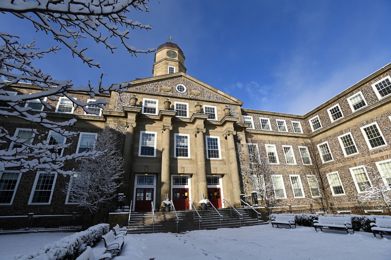 Henry Hicks in winter with snow and blue skies