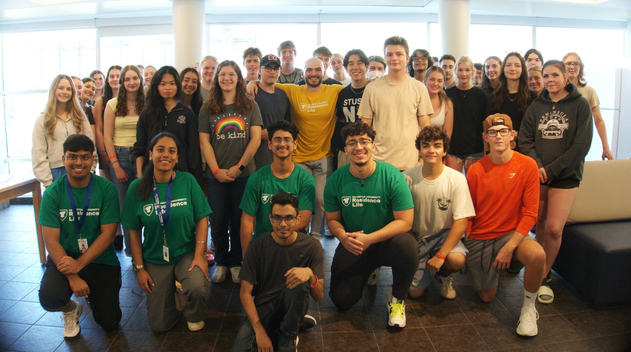 A group photo of many members of the residence life team, including CATs and CSTs.  