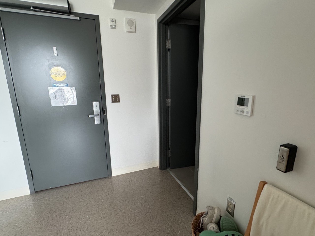 A photo of the entry door and washroom door in an accessible room in LeMarchant Place