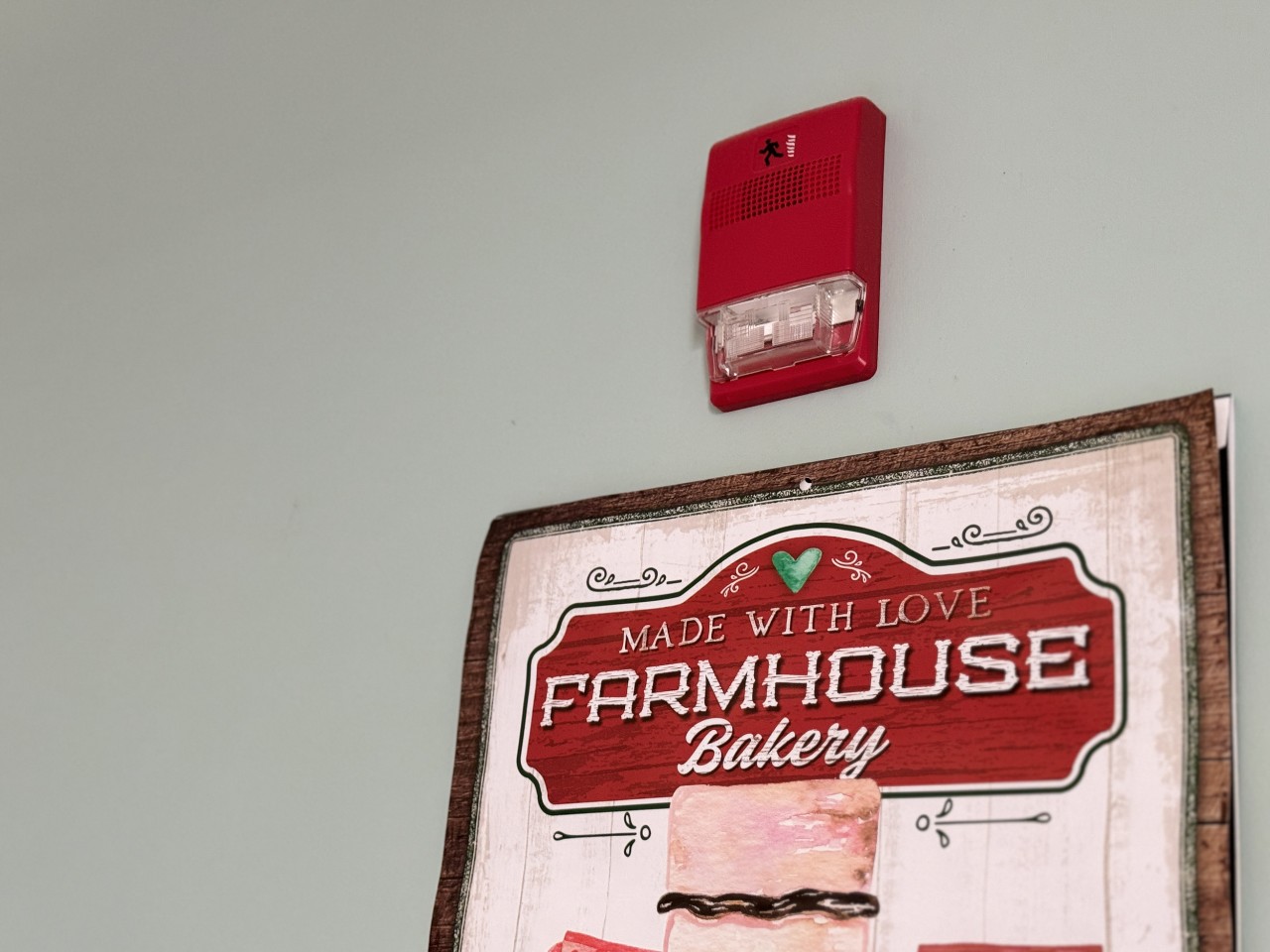 The flashing light and audio alarm on the wall in an accessible room in Risley Hall