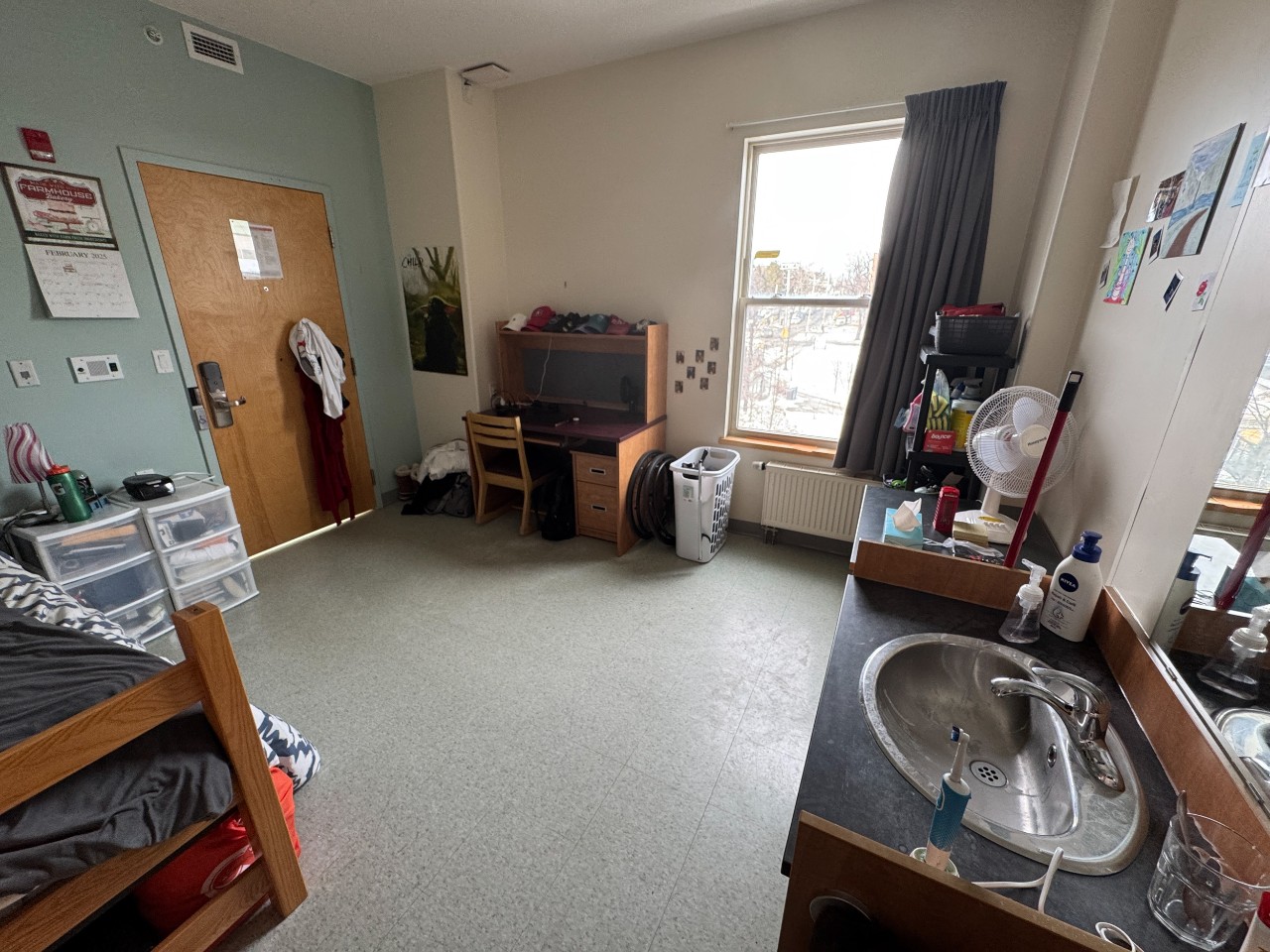 A photo of an accessible room in Risley Hall - showing the door, window and sink