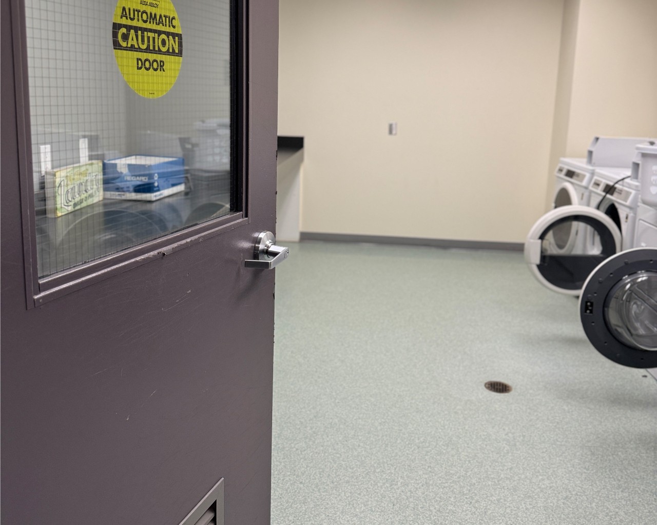 A laundry room in Risley Hall with an accessible automatic door