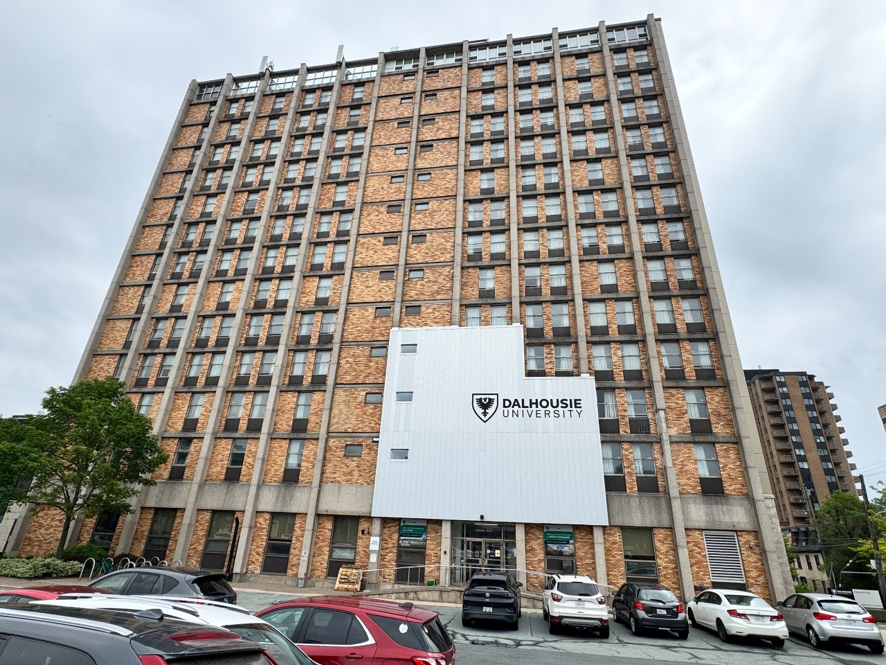 The front of Gerard Hall, featuring a large Dalhousie sign and brown brick