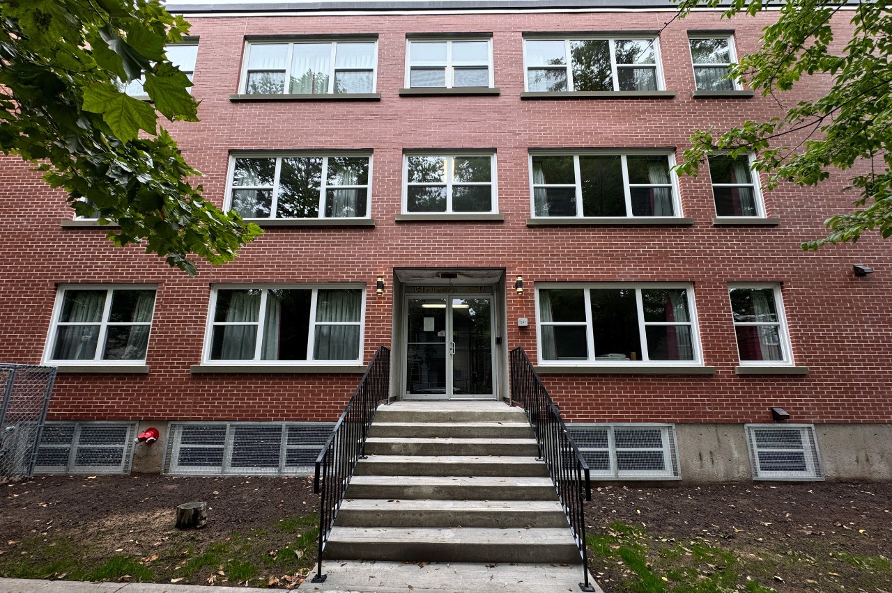 The front brick facade of Glengary Apartments, showing the front entrance and front steps. 
