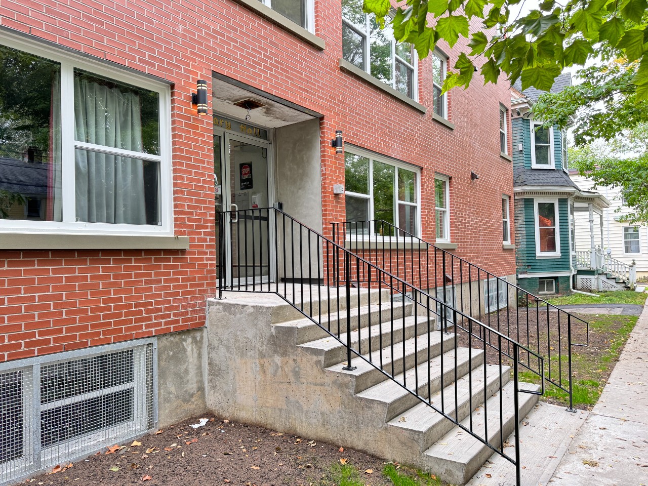 The front steps at Glengary Apartments, looking down the sidewalk