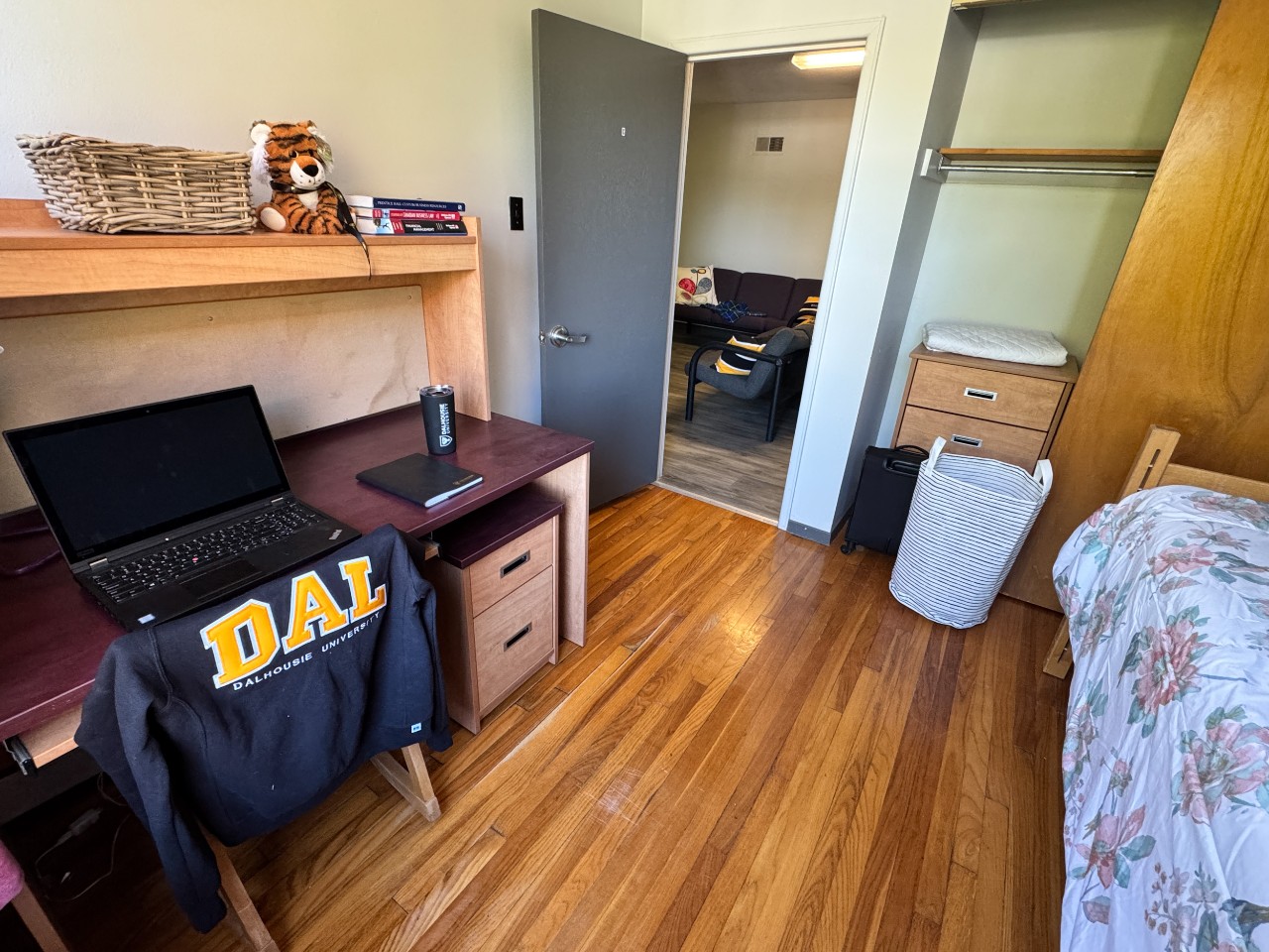One of the bedrooms in a 3-bedroom apartment in Glengary with a desk and closet