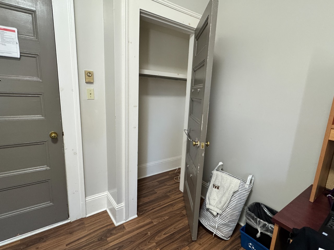 The spacious built-in closet in a single room at Grad House