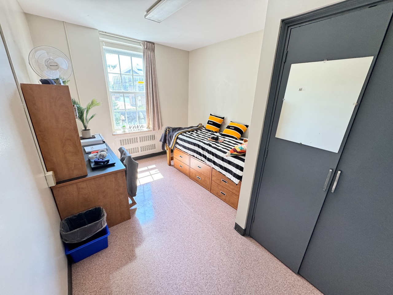 A single room in Bronson House features a built in closet