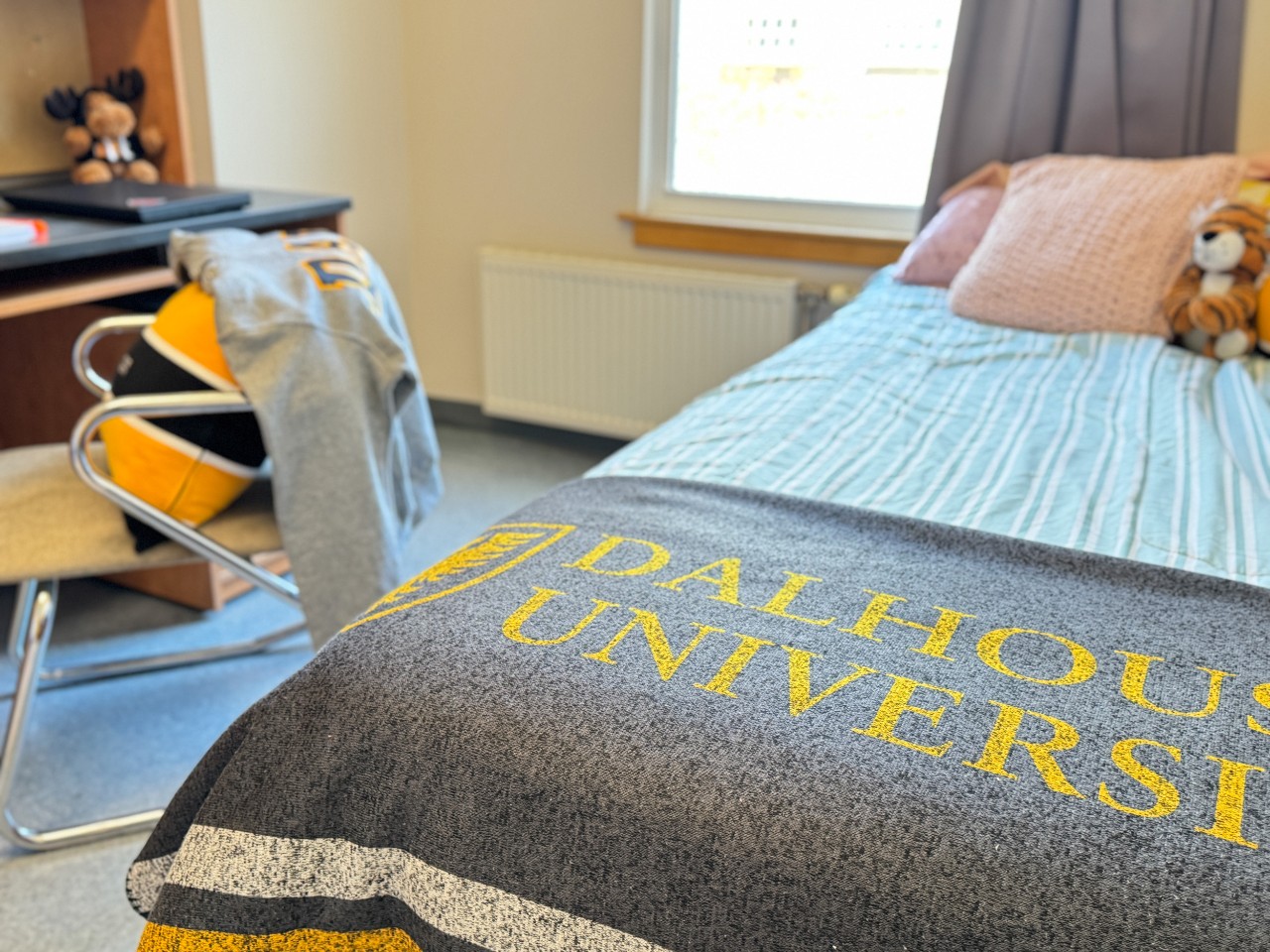 A close-up of the bed in a single room in Fountain House
