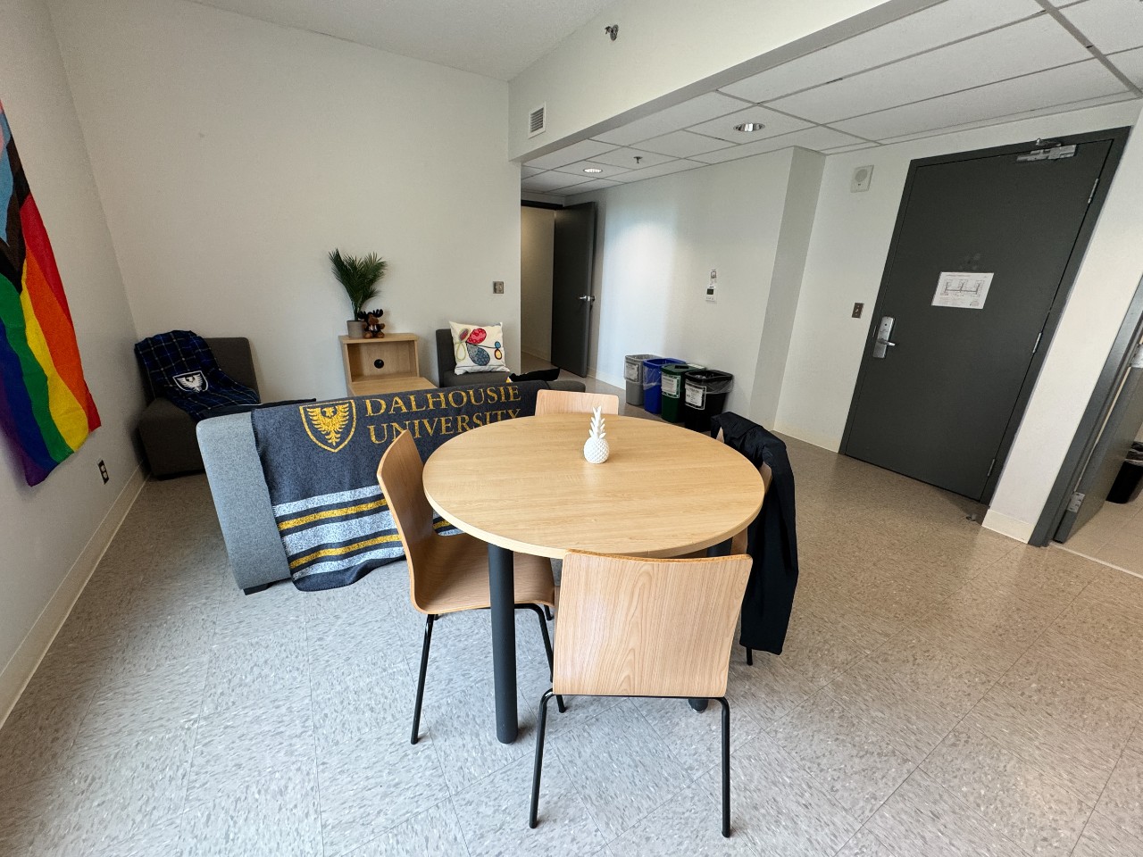 The dining area and living area in a 3-bedroom suite in LeMarchant Place