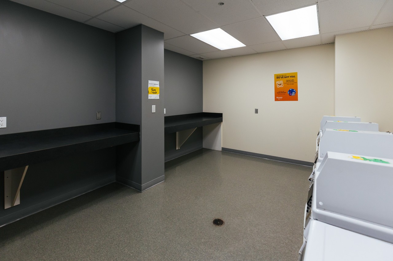 The long counters opposite the washing machines in a laundry room in Risley Hall