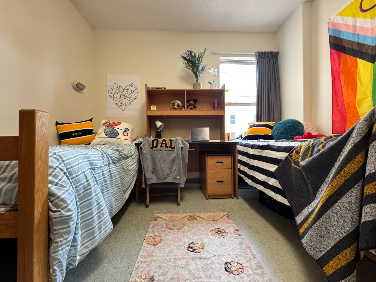 A double room in Risley Hall, with 2 adjustable beds, two desks, two wardrobes, and storage drawers.