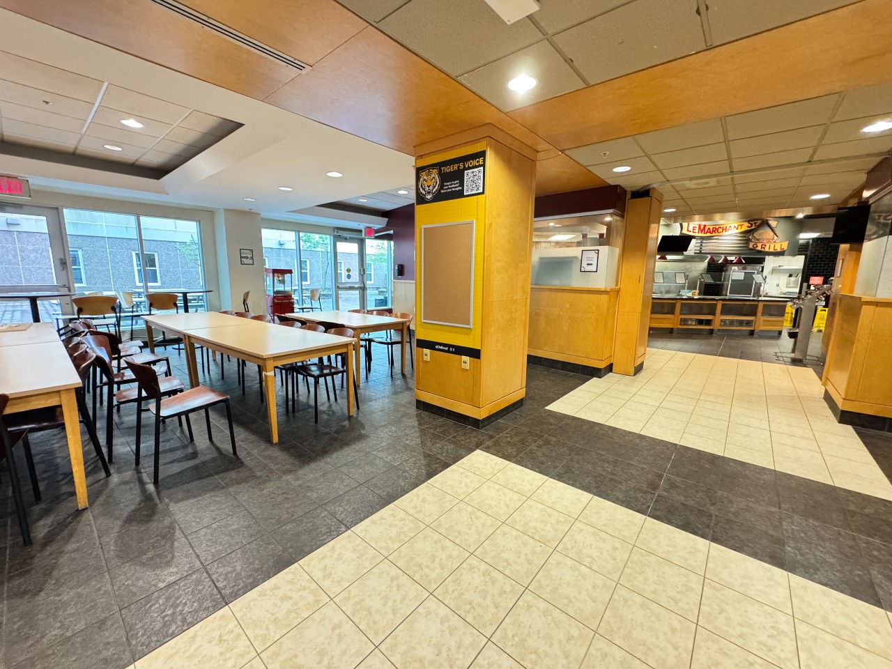 Long tables in the Risley dining hall seating area