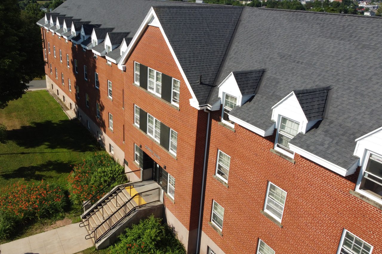 The red brick front of Chapman House as seen from an angled aerial photo