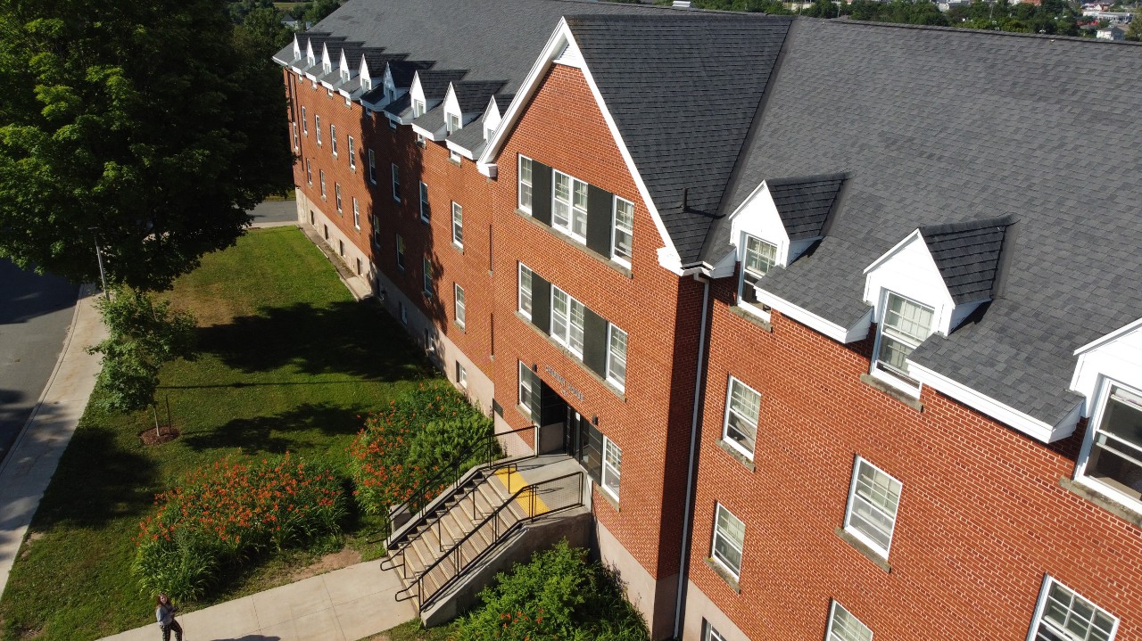 The red brick front of Chapman House as seen from an angled aerial photo