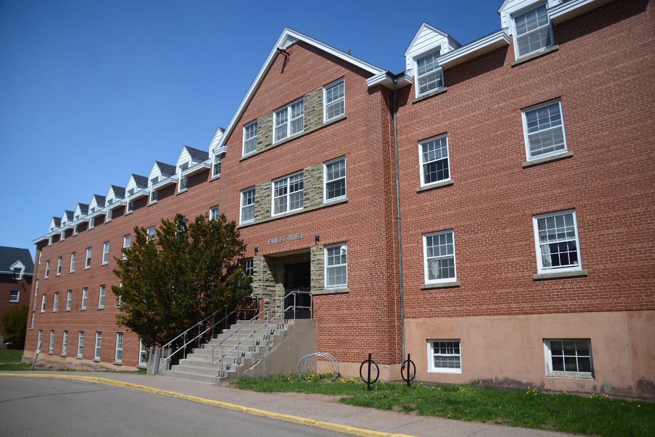 Exterior photo of Fraser House, showing the front steps of the building and adjoining pathways 