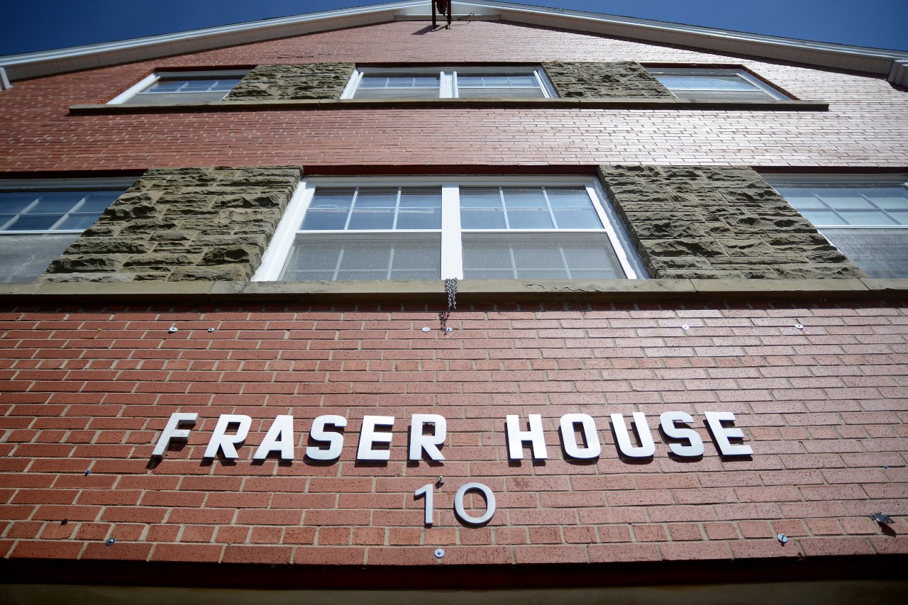 The sign above the front door of Fraser House as seen from below