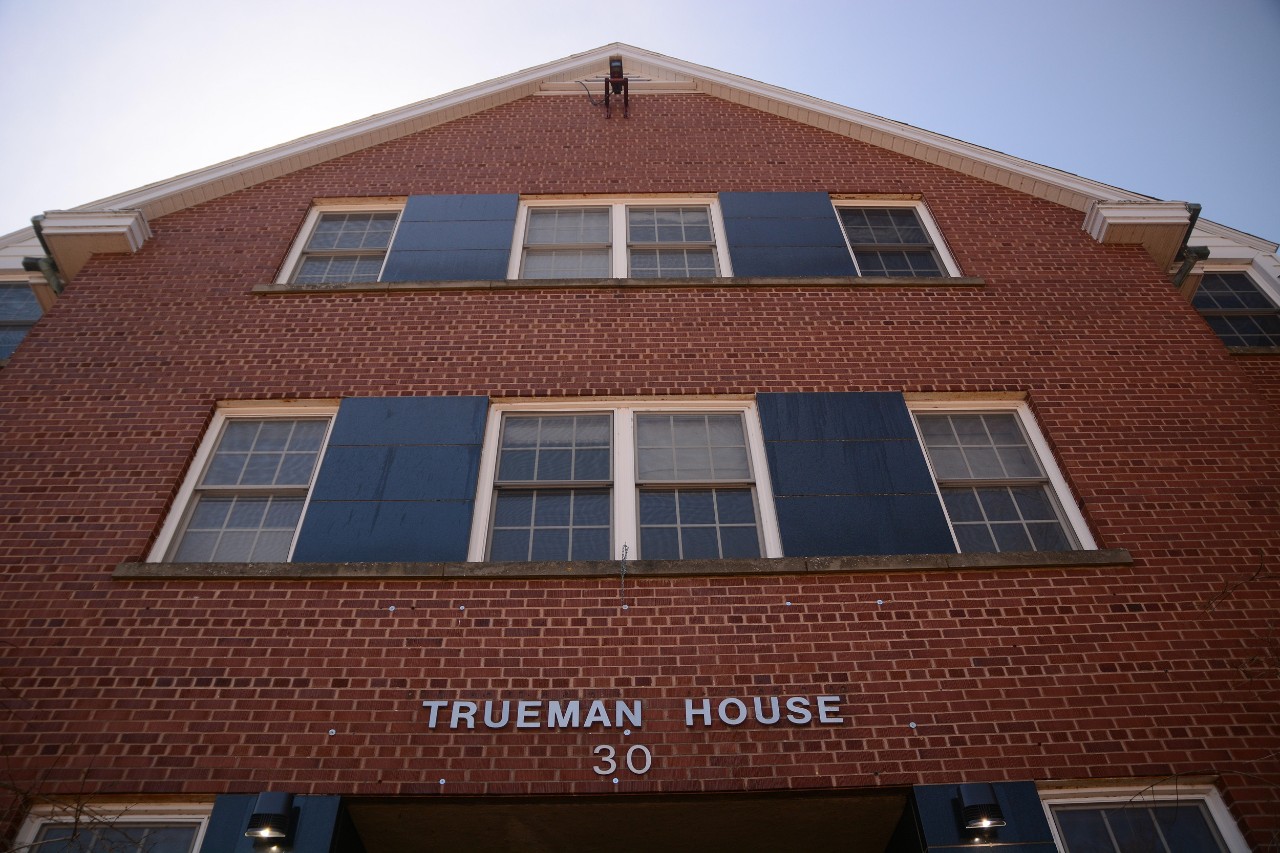 The sign above the front door of Trueman House as seen from below.