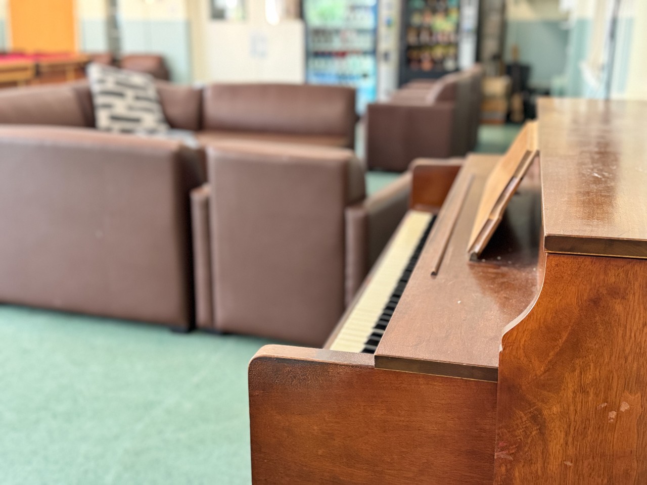 An antique piano in the lounge of Trueman House