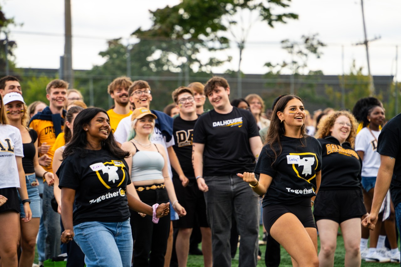 A group of off-campus students gathers on the Studley campus.