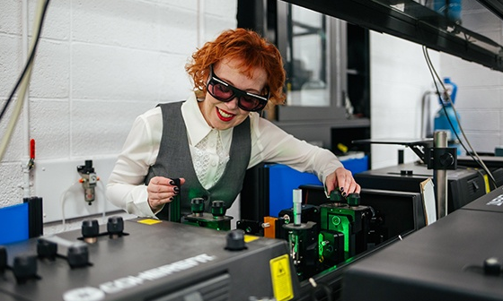 Students laughing at a desk