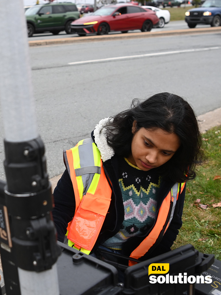 A female student is setting up field equipment
