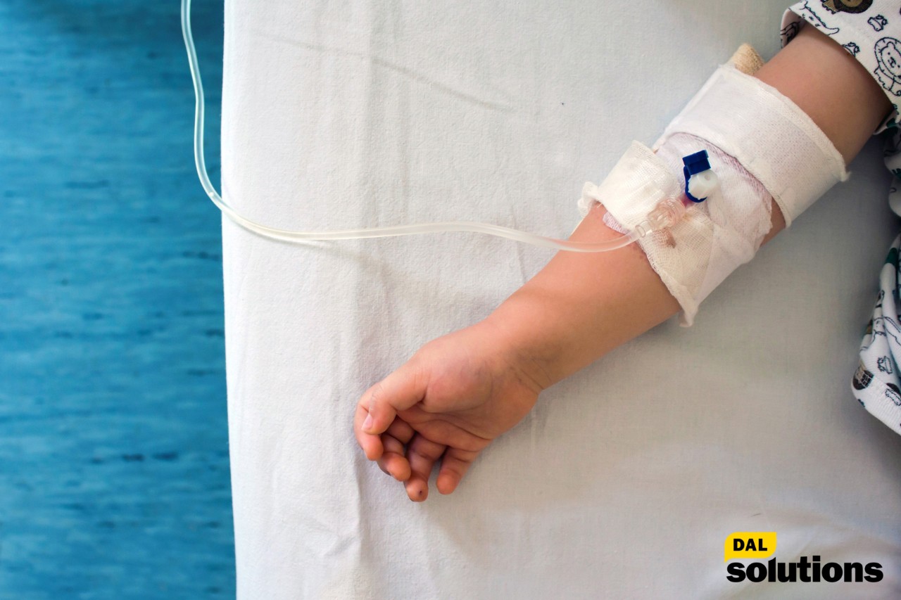 Arum Award Winner Igor Yushchenko sitting at desk in front of IY Law firm logo.