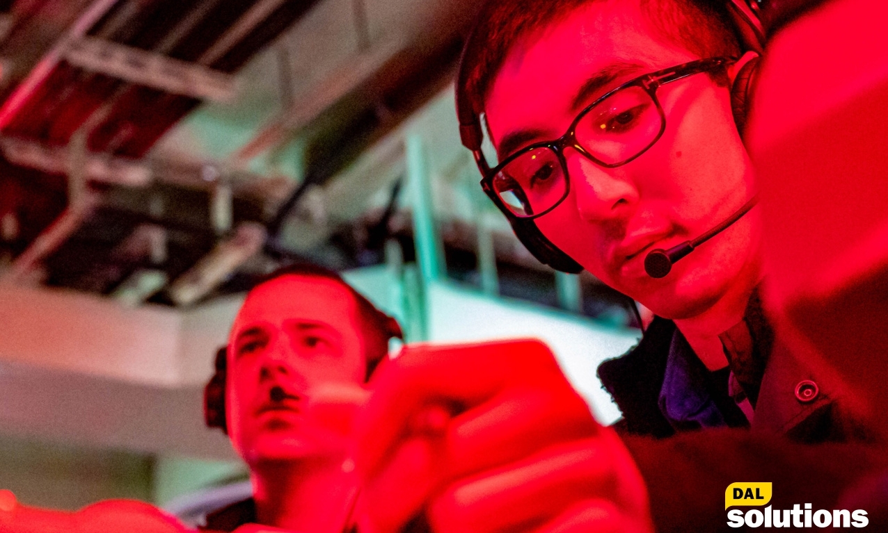 Technician wears a headphone at his work and shine by red light