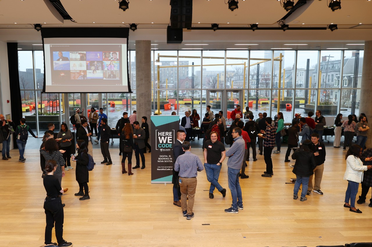 People mingle in the lobby of the Halifax Public Library.