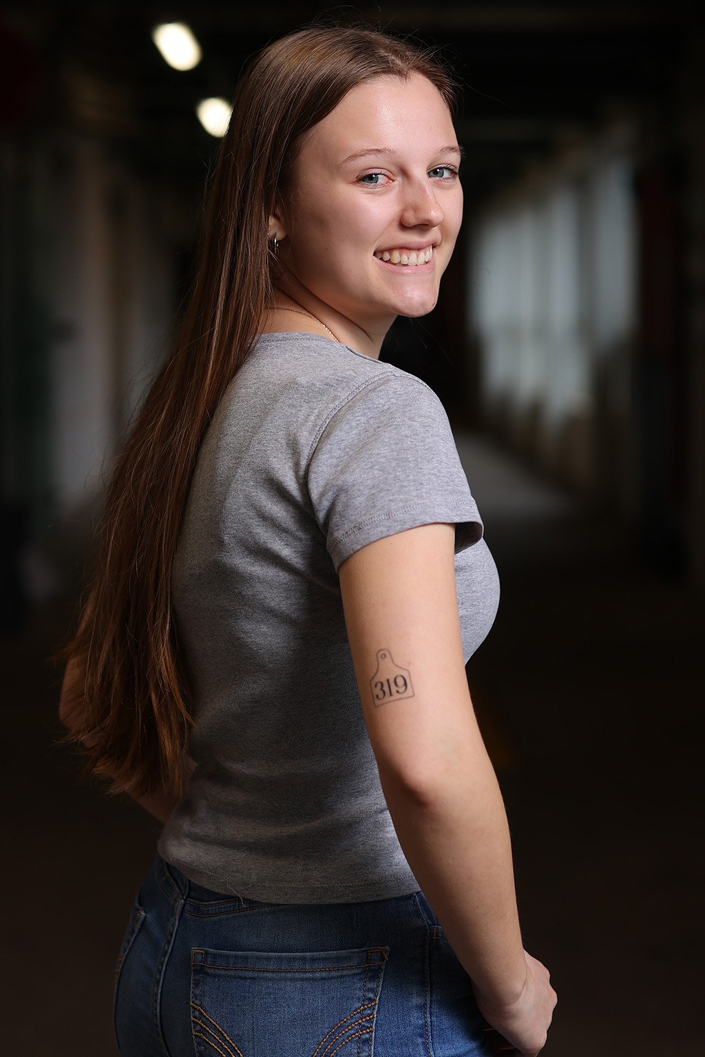 Emily Smith displaying her 319 tattoo