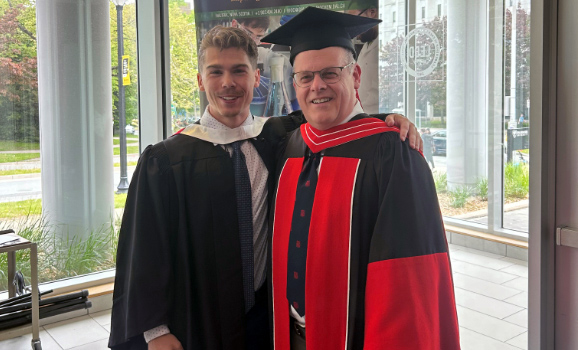 AJ Berrington standing with Dr. Stephen Bearne