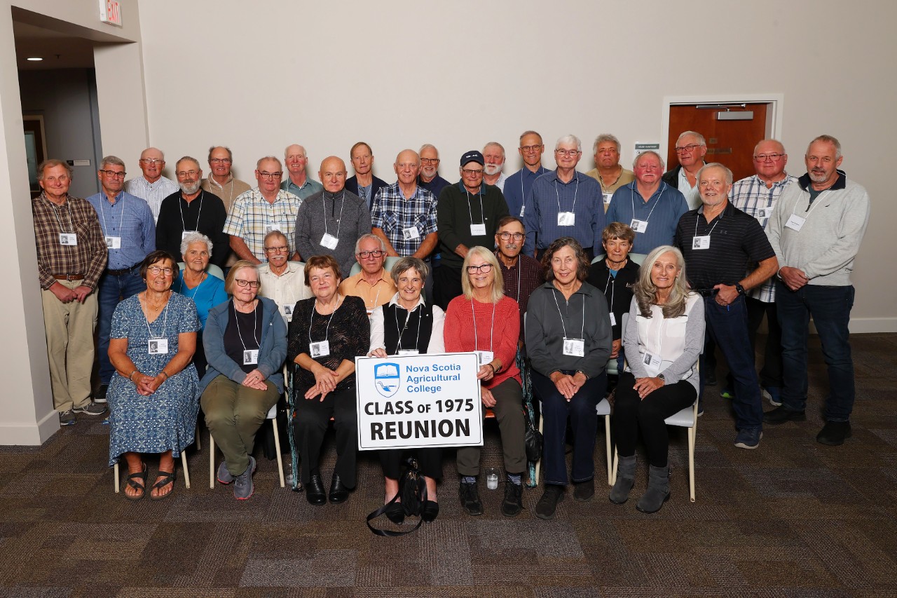 The class of 1975 posing for a reunion photo