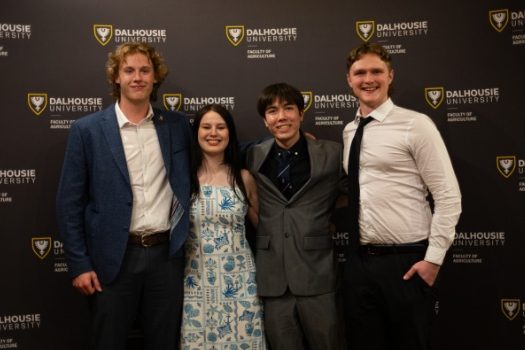 4 ag students standing in front of a Dalhousie background
