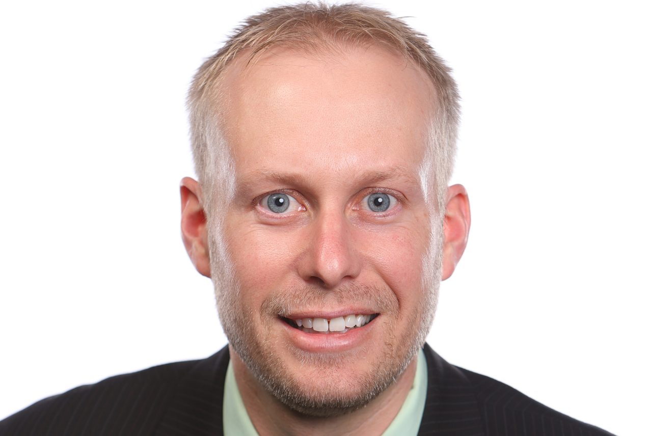 Headshot of Travis Esau