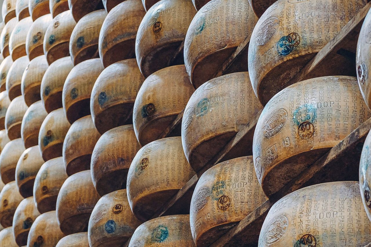 Stacked wheels of parmesan cheese.