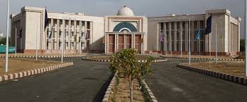 White stone building with a central dome.