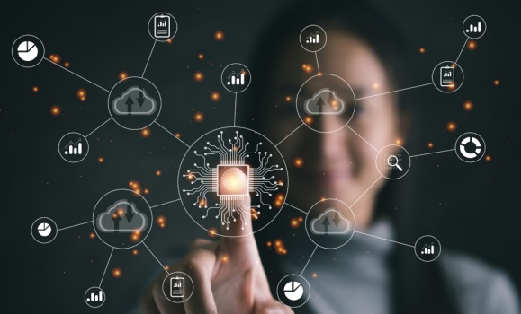 Woman behind a touchscreen with a web of internet icons.