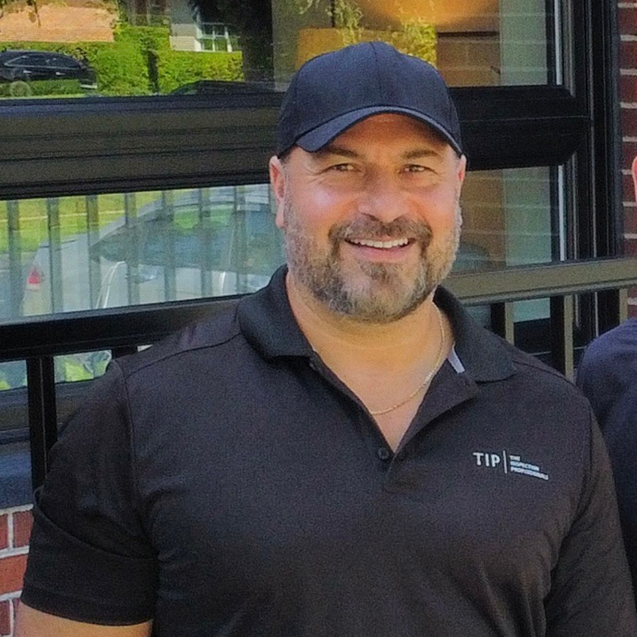 A man wearing a baseball cap who teaches in the Home Inspection program.