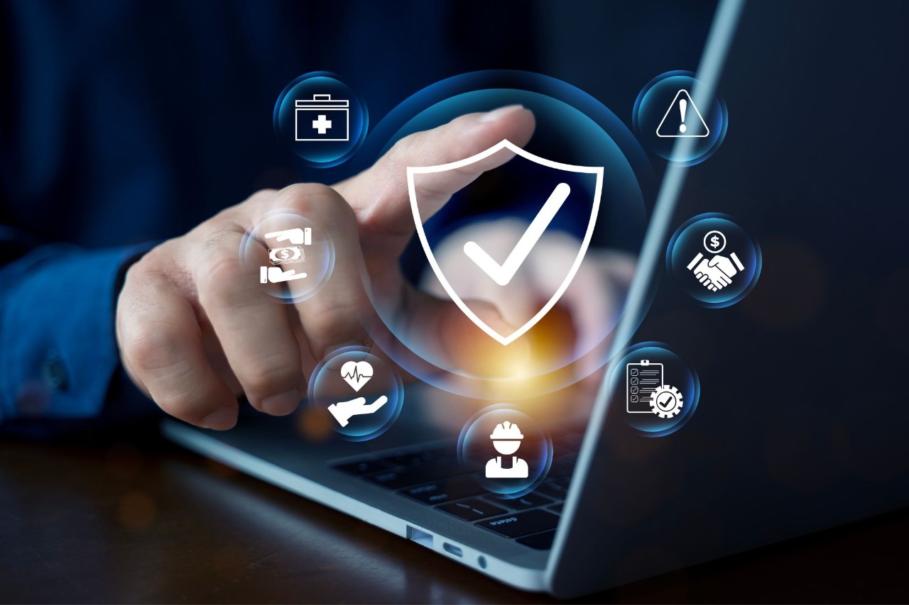 Person on laptop with symbols
