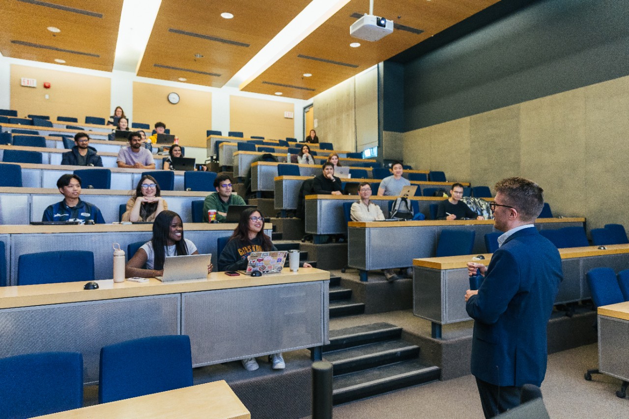 faculty teaching a classroom full of computer science students
