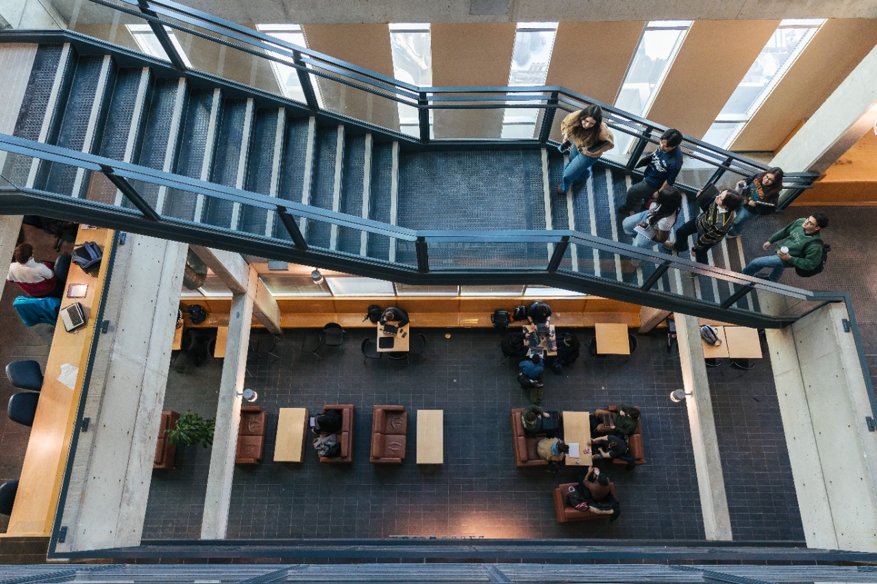 computer science students walking on staircase in Goldberg Building