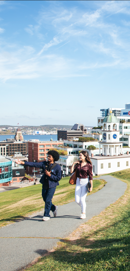 Two students sightseeing near the clocktower in downtown Halifax