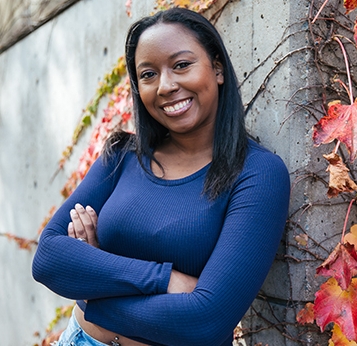 Outdoor shot of Tyeshia Angel Jordan, Gender and Women’s Studies and minor in Black and African Diaspora Studies graduate.