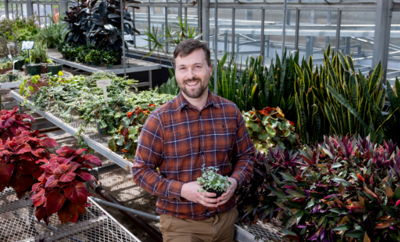 Jeff Robinson standing inside a greenhouse on the Agricultural Campus