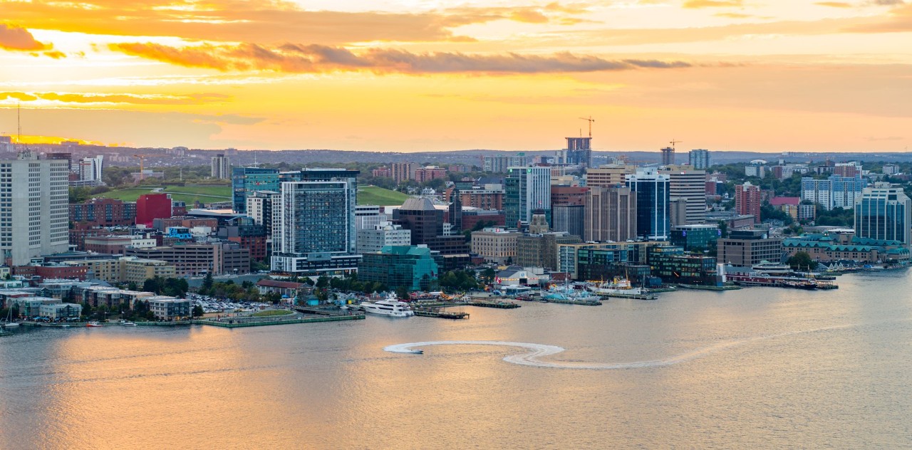 Halifax waterfront with city skyline. The sky is bright orange.